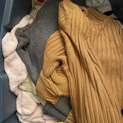 Smaller tote of sweaters