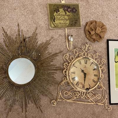 Beige color items including clock, hanger, mirror and art