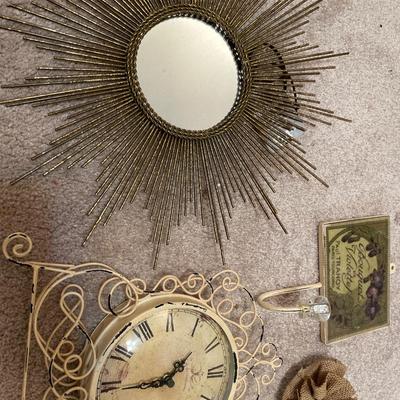 Beige color items including clock, hanger, mirror and art