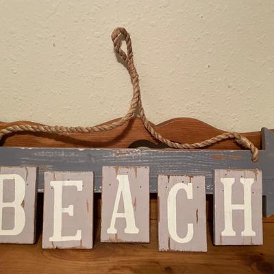 Time to relax , beach sign and white colored wood frame