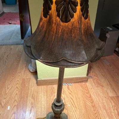 Tall dark lamp with hard resin shade