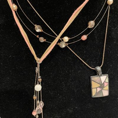 3 light pink colored necklaces