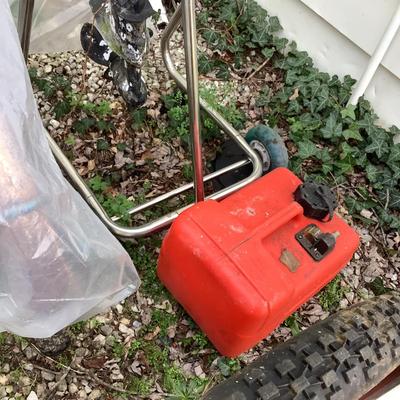 O764 Tohatsu 4 Strike Outboard Motor on cart / stand with gas tank