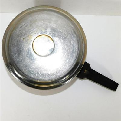 164 Presto Pressure Cooker With Pressure Regulator. Includes Instructions and Recipes 1990 15 x 17 1/2 approx.