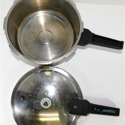 164 Presto Pressure Cooker With Pressure Regulator. Includes Instructions and Recipes 1990 15 x 17 1/2 approx.