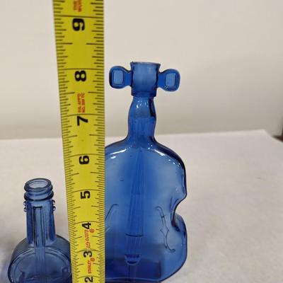 Collection of Blue Glass Bottles and Vases