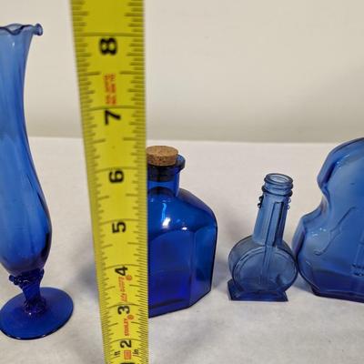 Collection of Blue Glass Bottles and Vases
