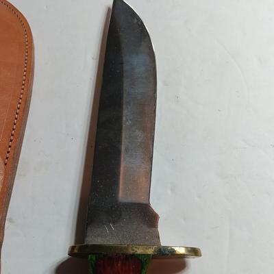 Stainless Pakistan made knife with beautiful multicolored wooden handle.