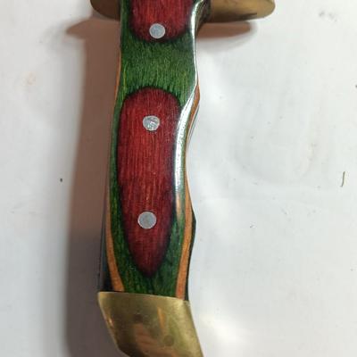 Stainless Pakistan made knife with beautiful multicolored wooden handle.