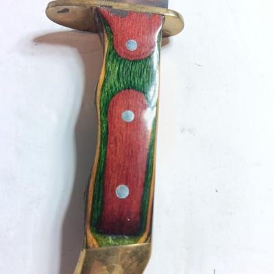 Stainless Pakistan made knife with beautiful multicolored wooden handle.
