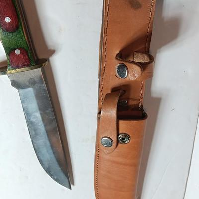 Stainless Pakistan made knife with beautiful multicolored wooden handle.