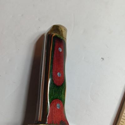 Stainless Pakistan made knife with beautiful multicolored wooden handle.