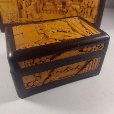 Set of Three High Relief Carved Camphor Wood Storage Boxes