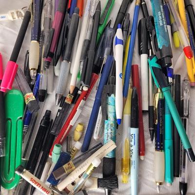 Lot of mechanical pencils, lead refills, sharpies, promotional pens, rulers and erasers.