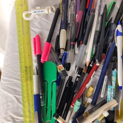 Lot of mechanical pencils, lead refills, sharpies, promotional pens, rulers and erasers.