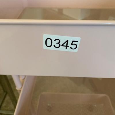 Pink Metal Organizer Shelf On Casters
