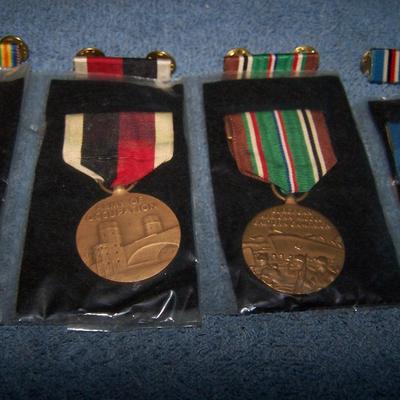 LOT 1 VINTAGE MILITARY MEDALS IN PACKAGE WITH BARS