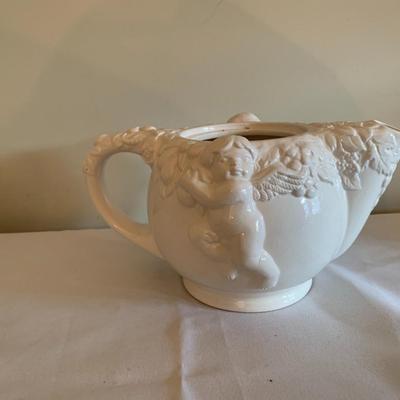 Vintage white tea pot with cherubs