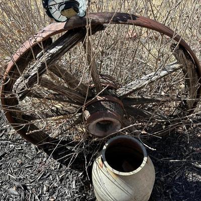 ANTIQUE WAGON WHEEL AND A METAL CONTAINER
