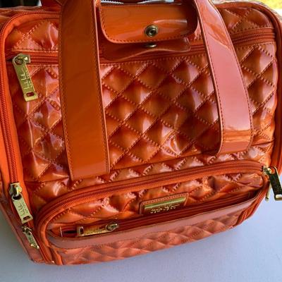 Nicole Miller Rolling Extending Handle Carry On Luggage