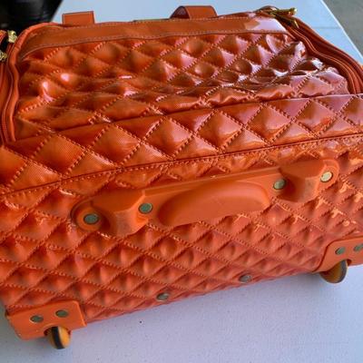 Nicole Miller Rolling Extending Handle Carry On Luggage