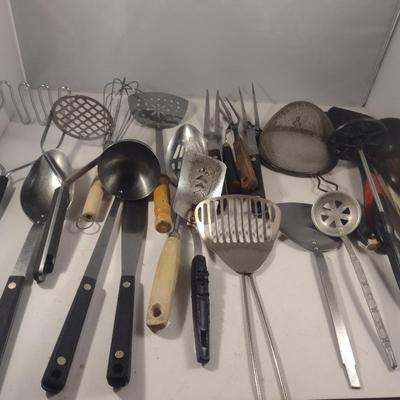 Collection of Kitchen Utensils in Ceramic Holder