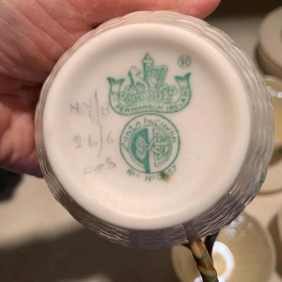Set of 11 Belleek teacups and 11 saucers