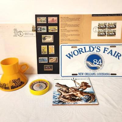 Lot #78 World's Fair Lot - Stamps, License Plate, Trivet, Cup, Game