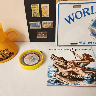 Lot #78 World's Fair Lot - Stamps, License Plate, Trivet, Cup, Game
