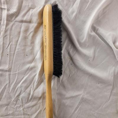 Antique marketing giveaway lint or upholstery brush.