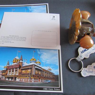 Lot 379: Misc Junk Drawer Lot, Postcards, Leach Keyrings, 76 Antenna Topper, More