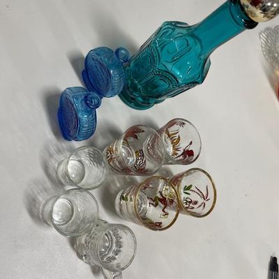 Shot glasses & blue bottles