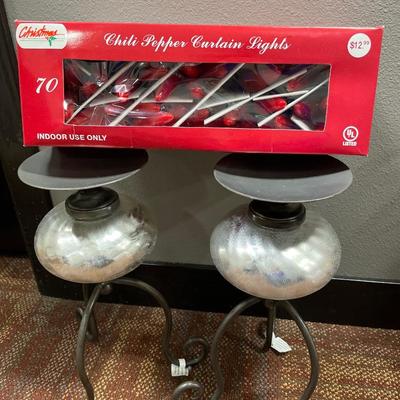 Silver candle holders and chili pepper lights