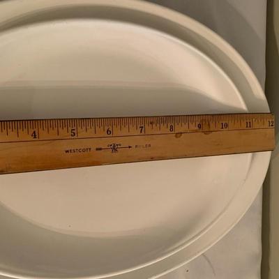 Assortment of large white serving platters