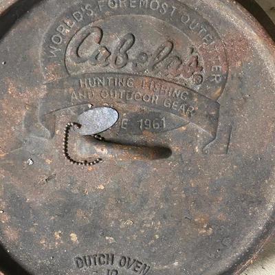 LOT 67: Outdoor Cooking - Two Cabela's Cast Iron Dutch Ovens and More