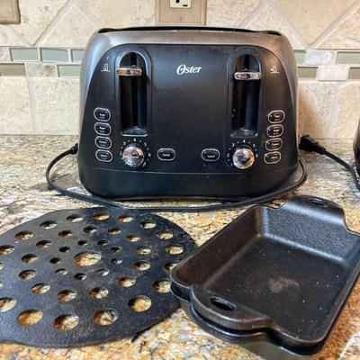 LOT 82: Kitchen Finds: Oster Blender and Toaster, Cast Iron Rectangle Bakeware , Starbucks Mugs and More