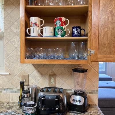LOT 82: Kitchen Finds: Oster Blender and Toaster, Cast Iron Rectangle Bakeware , Starbucks Mugs and More