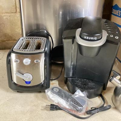 LOT 100: Basement Finds: Stainless Steel Trashcan, Keurig Coffeemaker, Krups Toaster, Cookware and Much More