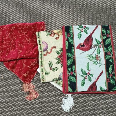 LOT 13: A Collection of Chistmas Themed Napkins, Table Runners, Tablecloths & Placemats in Various Sizes and Shapes