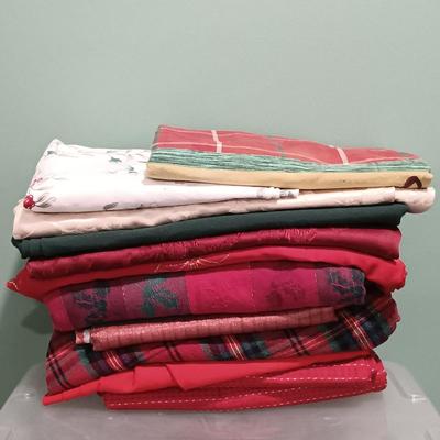 LOT 13: A Collection of Chistmas Themed Napkins, Table Runners, Tablecloths & Placemats in Various Sizes and Shapes