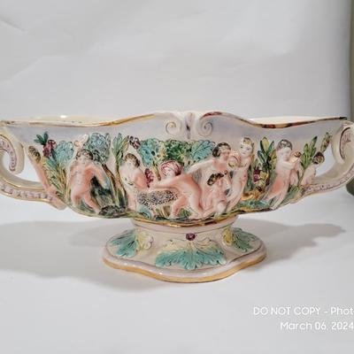 Massive Italian figural horned face handle bowl.
