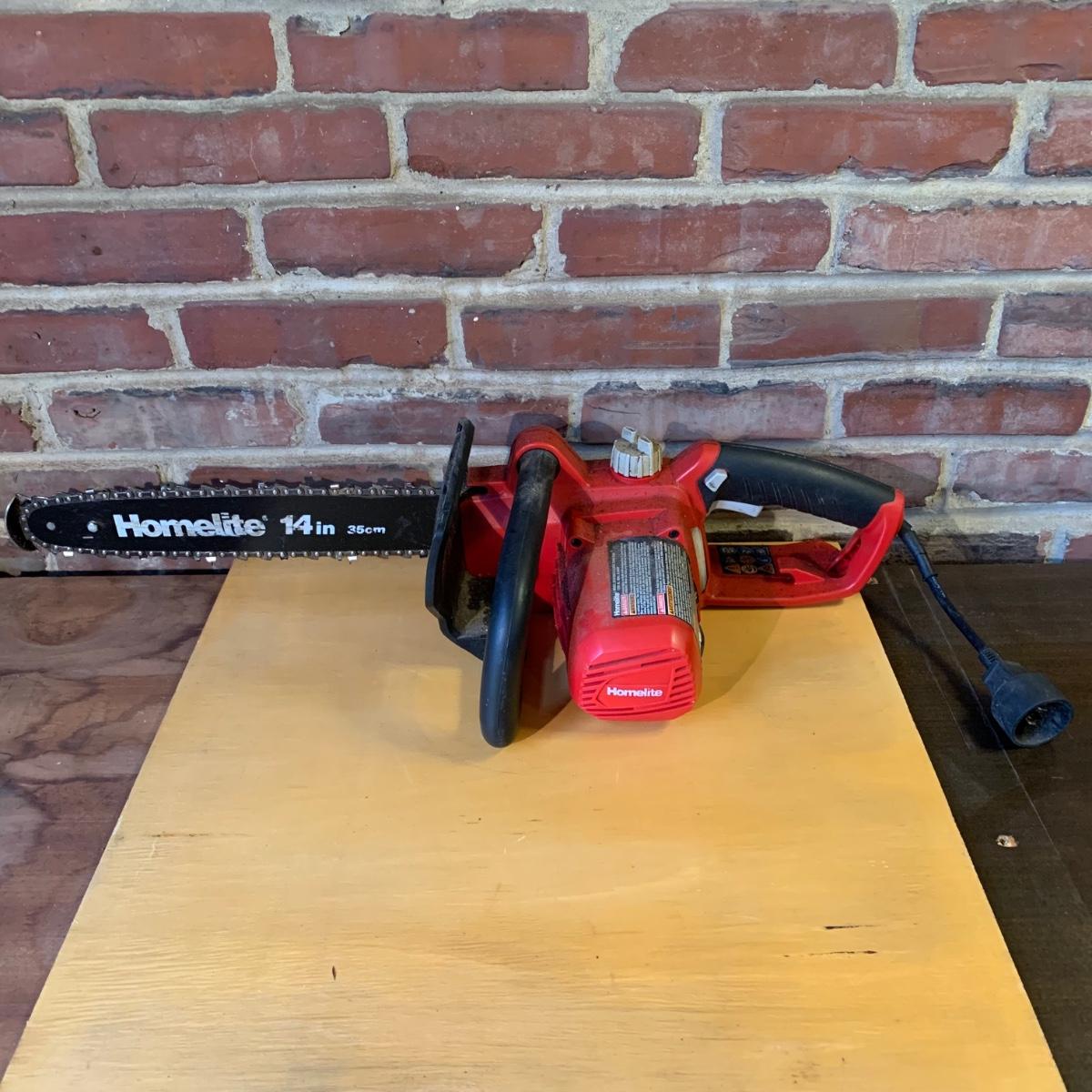LOT 115 Q Homelite 14" Electric Chain Saw Model UT43103A W/ Manual