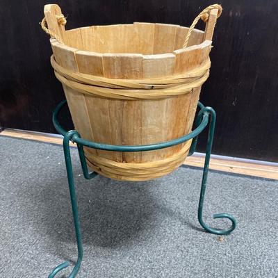 Green plant stand with wood basket