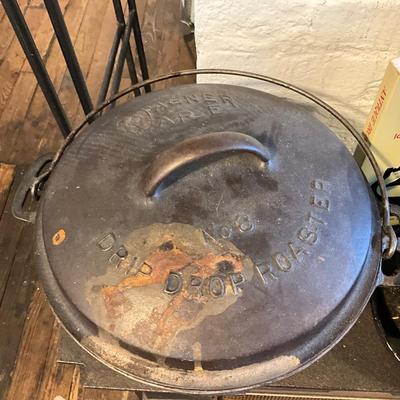1452 Cast Iron Lot = Wagnerware Roaster, Bookends, Two small skillets, Ice Shaver