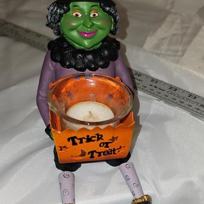 Cute witch with dangly legs candle holder
