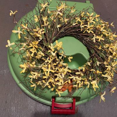 Assortment of faux flower wreaths with storage case