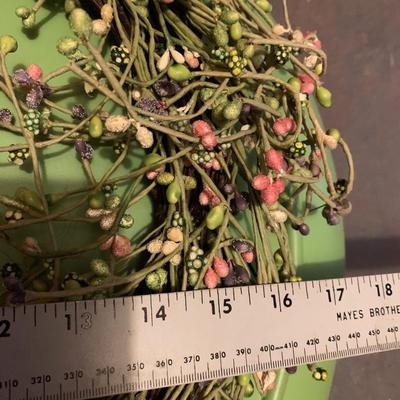 Assortment of faux flower wreaths with storage case