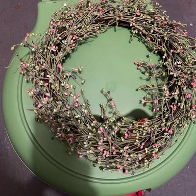 Assortment of faux flower wreaths with storage case