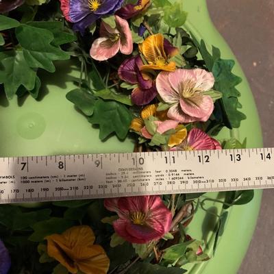 Assortment of faux flower wreaths with storage case