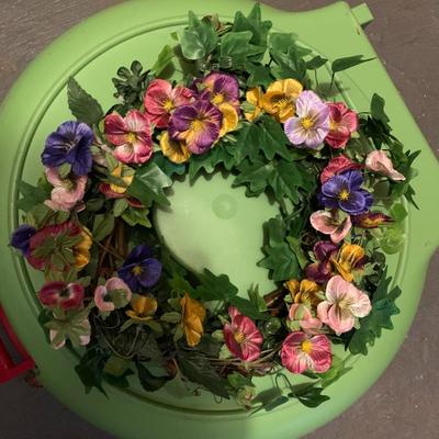 Assortment of faux flower wreaths with storage case